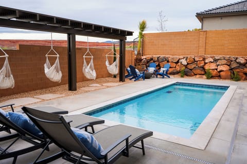 Fully fenced, private backyard with pool. 