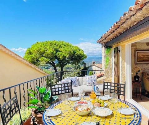 Terrace with barbecue, dining table and lounge seating area - and a magnificent 