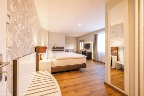 Premium bedding, down comforters, pillowtop beds, minibar