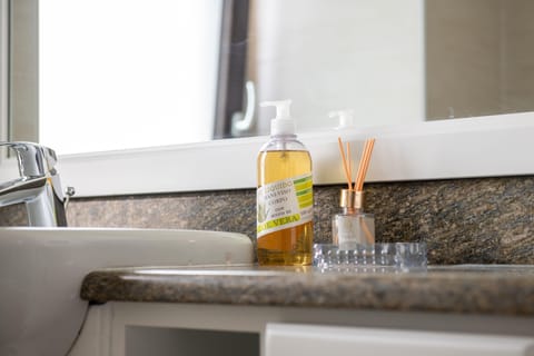 Quadruple Room | Bathroom | Shower, hair dryer, towels, soap