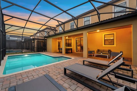 Unwind by the sparkling pool, where every sunset feels like a personal retreat. Pool safety fence provided but not pictured. 