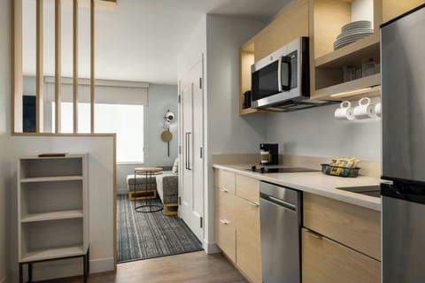 Desk, laptop workspace, iron/ironing board, free cribs/infant beds