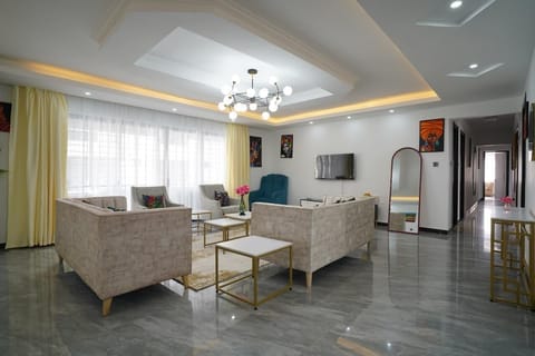 Family Apartment, City View | Living area | 24-inch Smart TV with digital channels