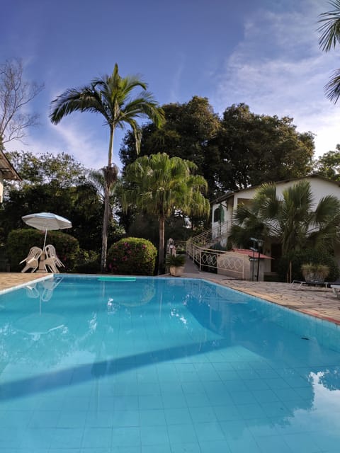 Outdoor pool, open 8:00 AM to 8:00 PM, pool umbrellas, sun loungers