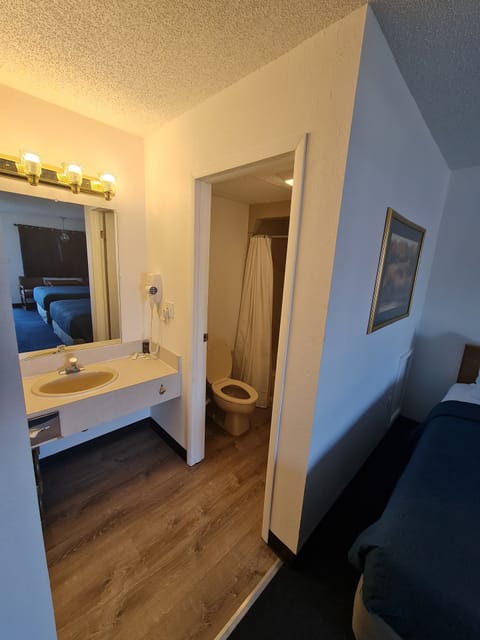 Standard Double Room, 2 Queen Beds | Bathroom | Combined shower/tub, hair dryer, towels