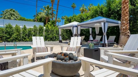 Relax by the cozy firepit, soaking in stunning mountain views.