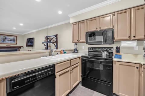 Kitchen: Well-equipped kitchen, updated appliances, drip coffee maker, kitchen island w/2 barstools
