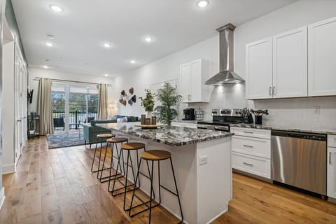 Granite countertops and large windows combine to create a bright, inviting space.