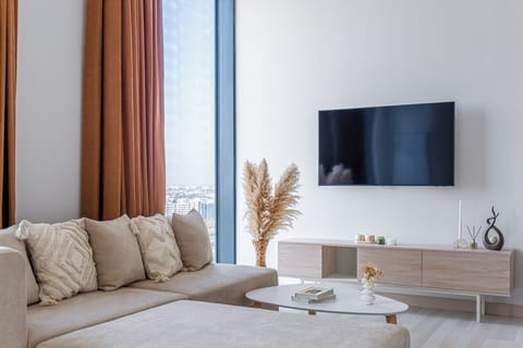 Apartment, City View | Living area | Flat-screen TV