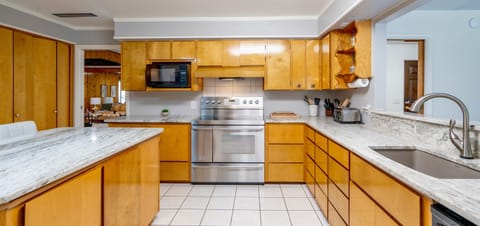 Retreat: Our kitchen, equipped with stainless steel appliances, serves as the retreat of the home. Conveniently located off the dining room, The Boardroom, Shrimp room & Moonshine Den, it's the perfect hub for cooking up delicious to be enjoyed together!