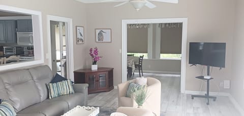 smart tv, electric recliners, swivel chairs, off the dining room, kitchen & deck