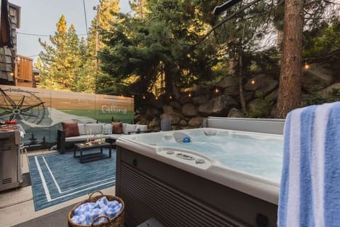 Hot tub, grill, and string lights - the perfect outdoor combination.