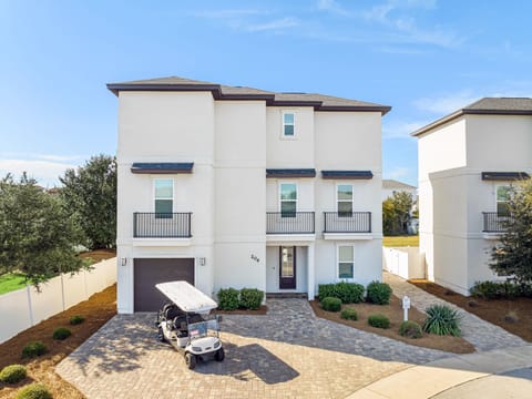 Grand Vista Chateau features a large driveway and golf cart