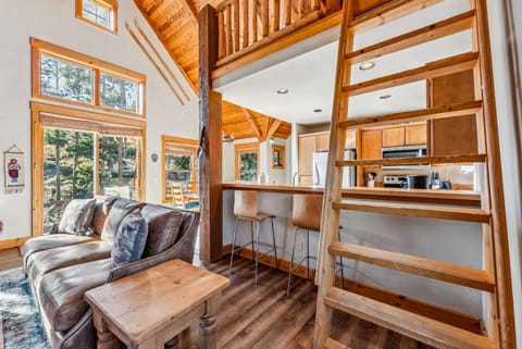 Living Room: View into kitchen and stairs up to the loft
