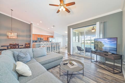 BT825 - Living with TV and sliding doors opening to the screened in balcony
