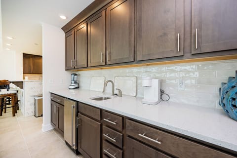 Grab a chilled drink from the fridge or create your favorite cocktail at the wet bar