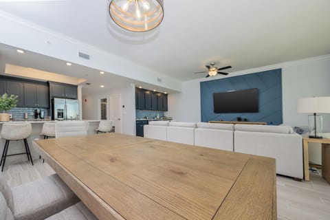 Gather for a family meal or enjoy a good movie in this elegant family room and create memorable moments