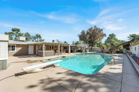 Dive into the huge private pool or relax in the jacuzzi—your outdoor retreat awaits.