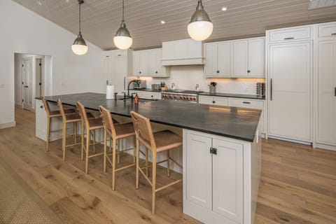 This spacious island provides a perfect setting for having your morning coffee or a glass of wine | Upper Level