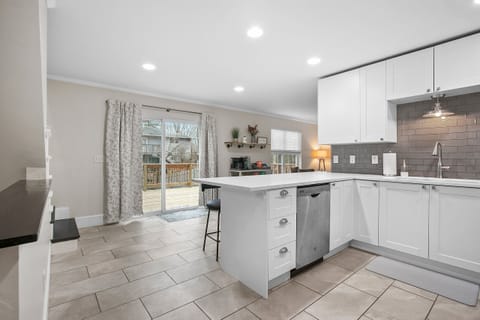 Sliding glass doors lead to second story deck