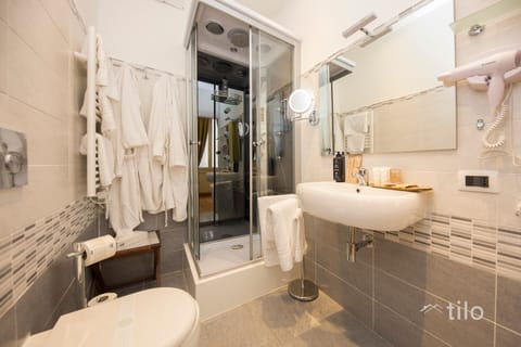 Exclusive Room, City View | Bathroom | Designer toiletries, hair dryer, bathrobes, slippers