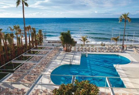Indoor pool, outdoor pool, pool umbrellas, sun loungers