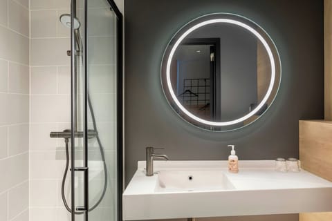 Shower, eco-friendly toiletries, hair dryer, towels