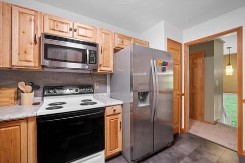 Fully stocked kitchen with all utensils and cookware needed.