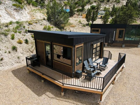 Indoor-outdoor living at its best, with mountain views, a private fire pit, and a peaceful deck for sunset evenings at East Zion Resort.