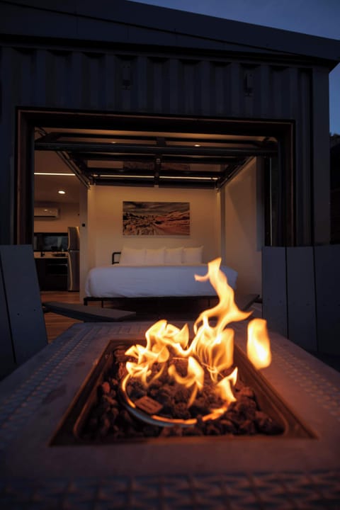 Private outdoor deck with a gas fire pit and seating, perfect for cozy evenings at your modern cabin near Zion National Park and Bryce Canyon.