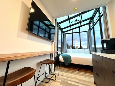 Wake up surrounded by natural light and mountain views inside Wild Sage, a modern container cabin near Zion National Park and Bryce Canyon.