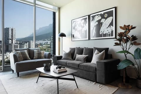 Spacious living area with modern décor and plenty of natural light.