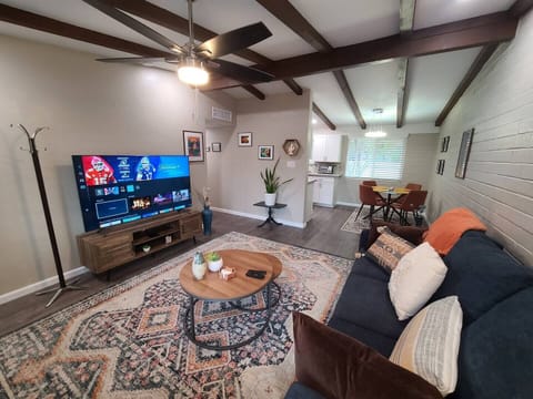 65" Samsung smart TV with soundbar.