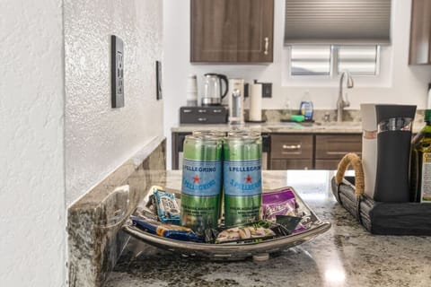 Coffee & cocktail station w/ granite counters, stocked essentials, and a cozy spot to start or end the day.