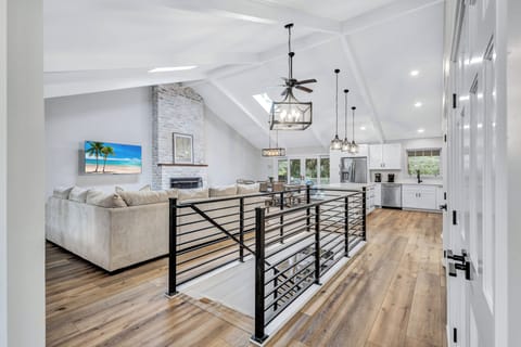 Spacious living area with vaulted ceilings and large deck access