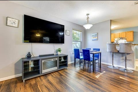 Share stories and laughter around the dining table, perfect for family meals or game nights. The comfortable chairs and cheerful ambiance make this a favorite spot to gather.