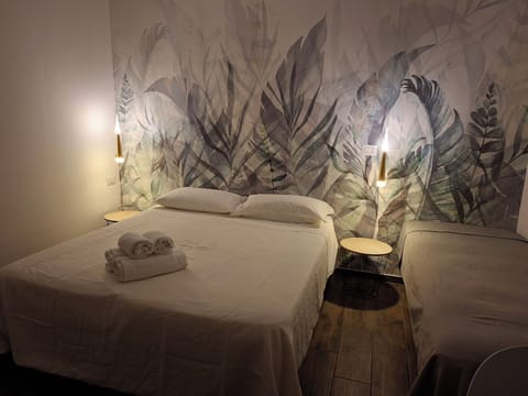 Premium Triple Room, Non Smoking, Private Bathroom | Down comforters, desk, laptop workspace, blackout drapes