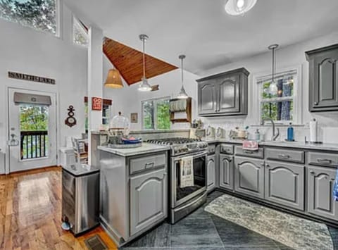 Fully stocked kitchen with nice gas stove.