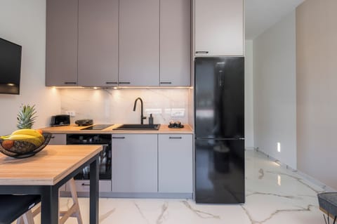 Deluxe Apartment, 2 Bedrooms, Beachside | Private kitchen | Oven, stovetop, electric kettle, toaster