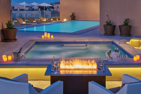 Outdoor pool, open 6:00 AM to 11:00 PM, free cabanas, pool umbrellas