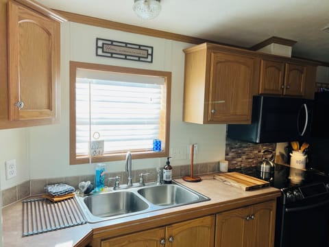 Kitchen has a garbage disposal.