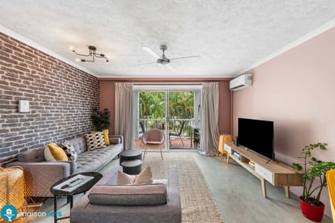 Large living area with plenty of comfortable seating.