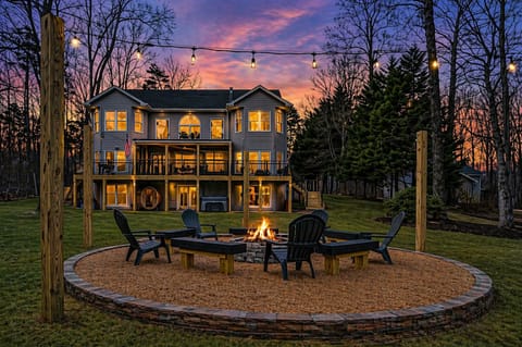Relax in the sauna and hot tub, gather around the large fire pit, or enjoy the sandy beach area. The calm waters provide plenty of space for swimming, kayaking, and soaking up lake life.