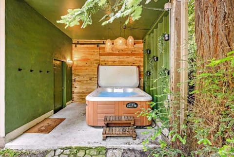  Rain or shine, relax in this secluded hot tub oasis with views of towering redwood trees.