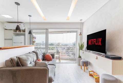 Loft 305 | Living area | Flat-screen TV