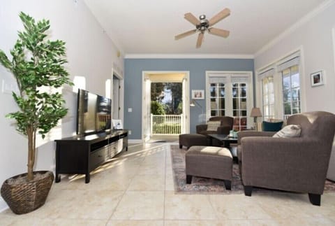 Bright and spacious living room with cozy seating and plenty of natural light.