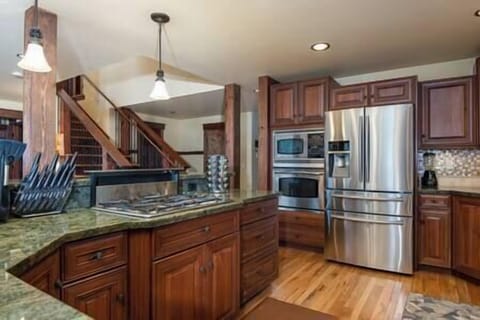 Large Kitchen with utensils, pots, pans, knives, spices 