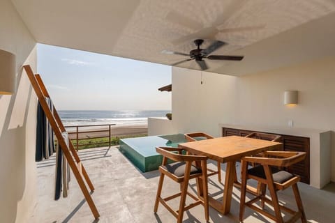 Dine in paradise with this outdoor seating area, offering a peaceful atmosphere and uninterrupted ocean views.