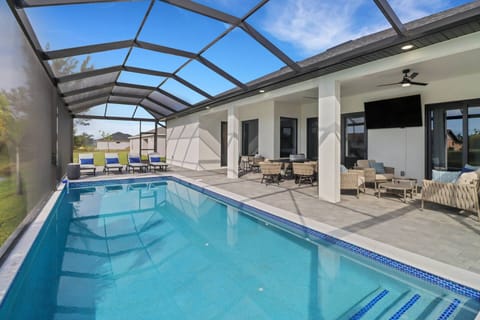 Create endless hours of family fun in the fully screened outdoor living space.