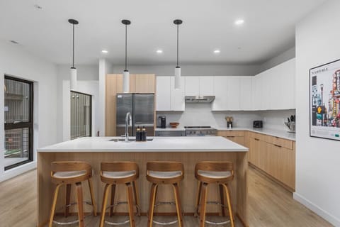Seating for four at the island in this spacious contemporary kitchen.